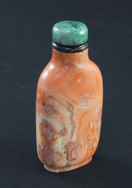 A Chinese coral snuff bottle, 1800-1900, 5.7cm, filler to natural faults